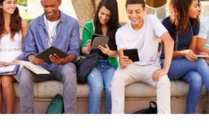 Teenagers on media devices